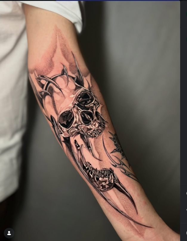 Bold blackwork skull and tribal tattoo sleeve