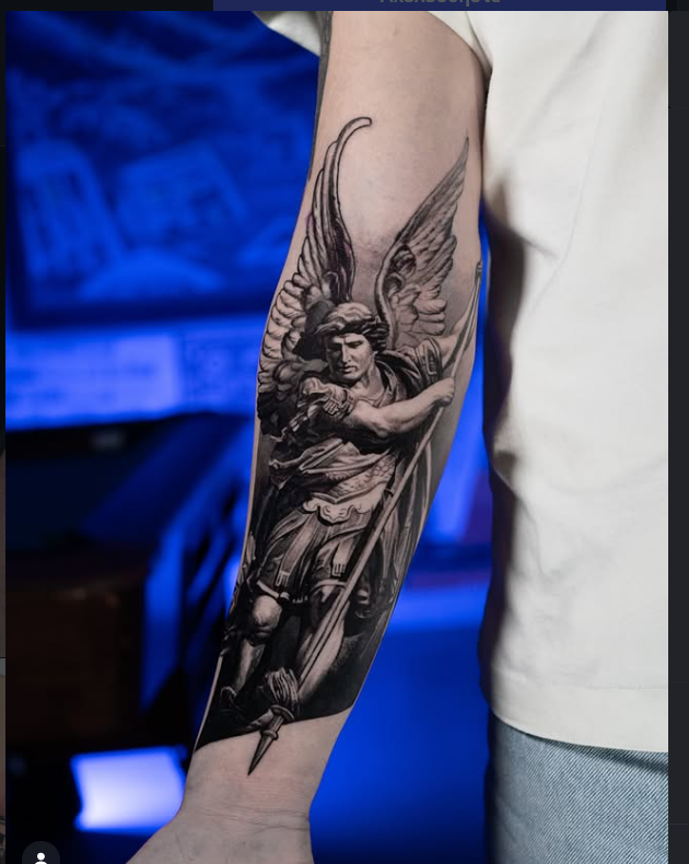Realism archangel statue forearm tattoo